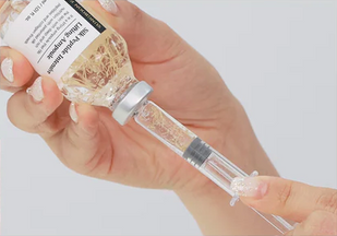 Insert the syringe and tilt to dispense